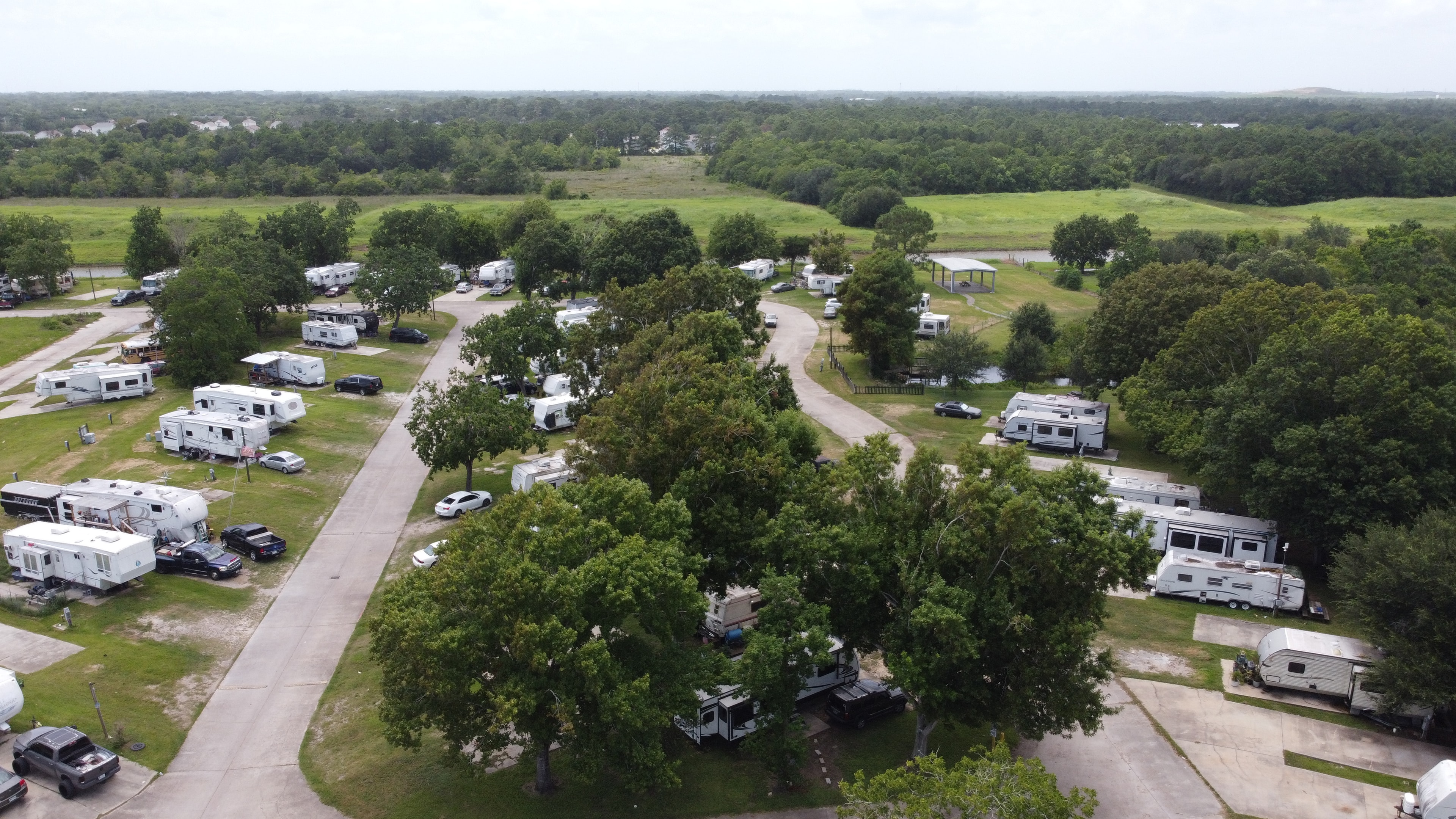 Lazy D RV Park – drone view of park with green landscape
